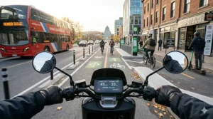An illustration of a moped-style electric scooter charging in a Canadian residential garage using a standard outlet.