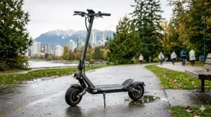 Close-up showing the secure, water-tight charging port cover on an IPX5 rated electric scooter.