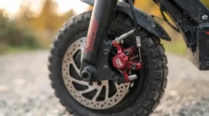 Detail view of responsive hydraulic disc brakes on a 2000w electric scooter.