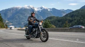High-performance electric motorcycle cruising on a paved Canadian highway.