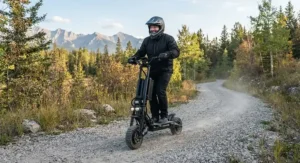 An adult rider navigating a gravel park trail in Alberta on a rugged dual battery scooter for heavy riders.