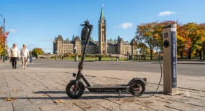 An affordable fast charging electric scooter parked near Parliament Hill in Ottawa on a clear autumn day.