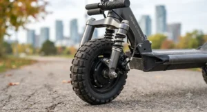 Wide tires and dual suspension on an electric scooter for medium commutes designed for urban pavement.