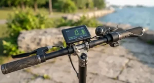 Close-up of a handlebar LED digital dashboard and smartphone app tracking speed and battery metrics for a popular Canadian market e-scooter.