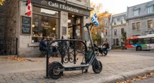 A modern electric scooter with fast charging features parked in front of a cafe in Montreal