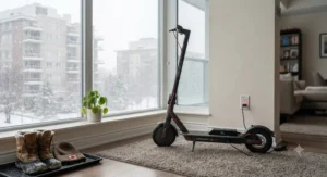 An electric scooter for apartment charging indoors during a snowy Canadian winter day.