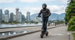 Experienced rider wearing a certified helmet operating a high speed electric scooter for experienced riders in Vancouver.