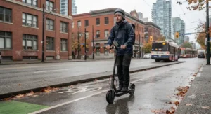 Rider navigating an urban bike lane on a reliable electric scooter built for Canadian weather conditions.