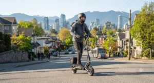 A powerful 32 km/h scooter for city riding climbing an urban slope with ease during a weekday morning commute.