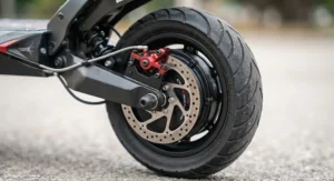 Close-up of dual hydraulic brakes and powerful motor on a high speed electric scooter for experienced riders.