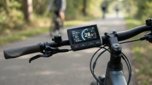 Close-up of a speed limited vs unrestricted electric scooter handlebars showing digital speed adjustment controls.